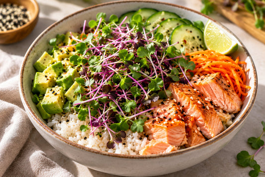 Salmon rice bowl with avocado, cucumber, carrot and purple-stemmed radish microgreens
